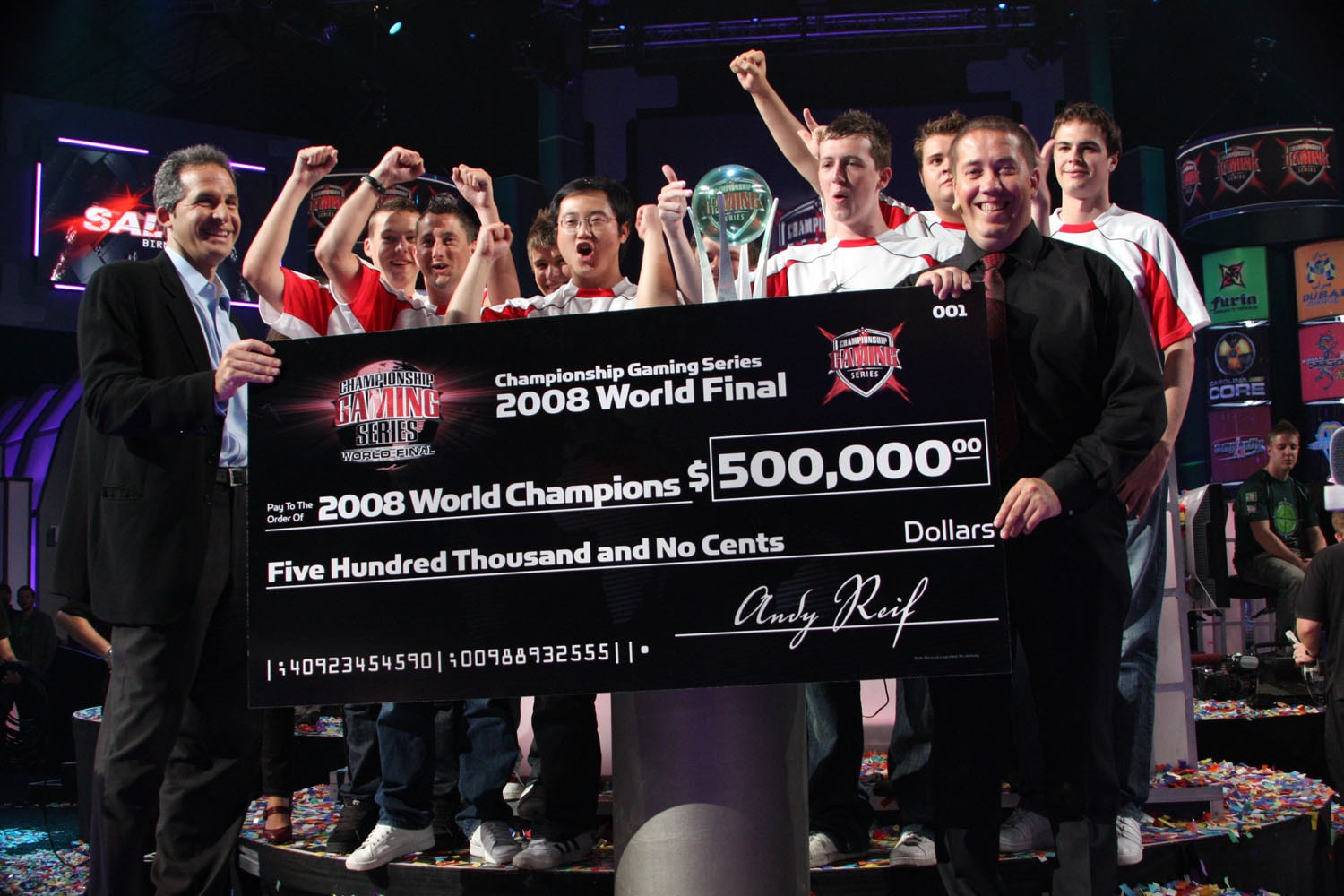 The 2008 Championship Gaming Series champions stand behind an oversize prize check.