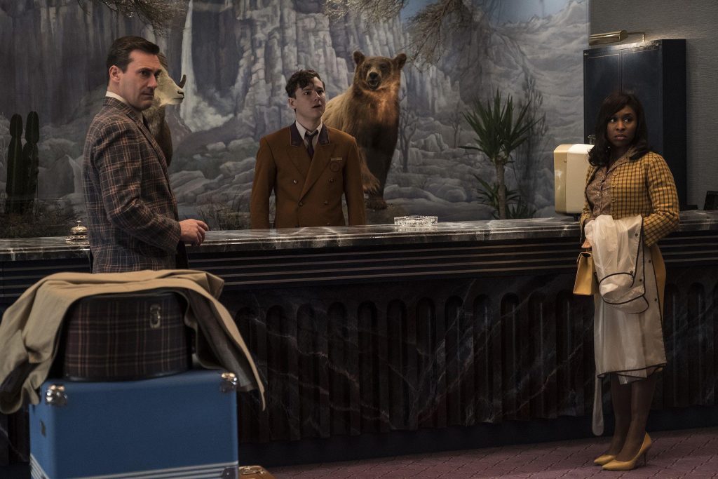 Laramie Seymour Sullivan, Miles Miller,  and Darlene Sweet stand together in the lobby of the El Royale.