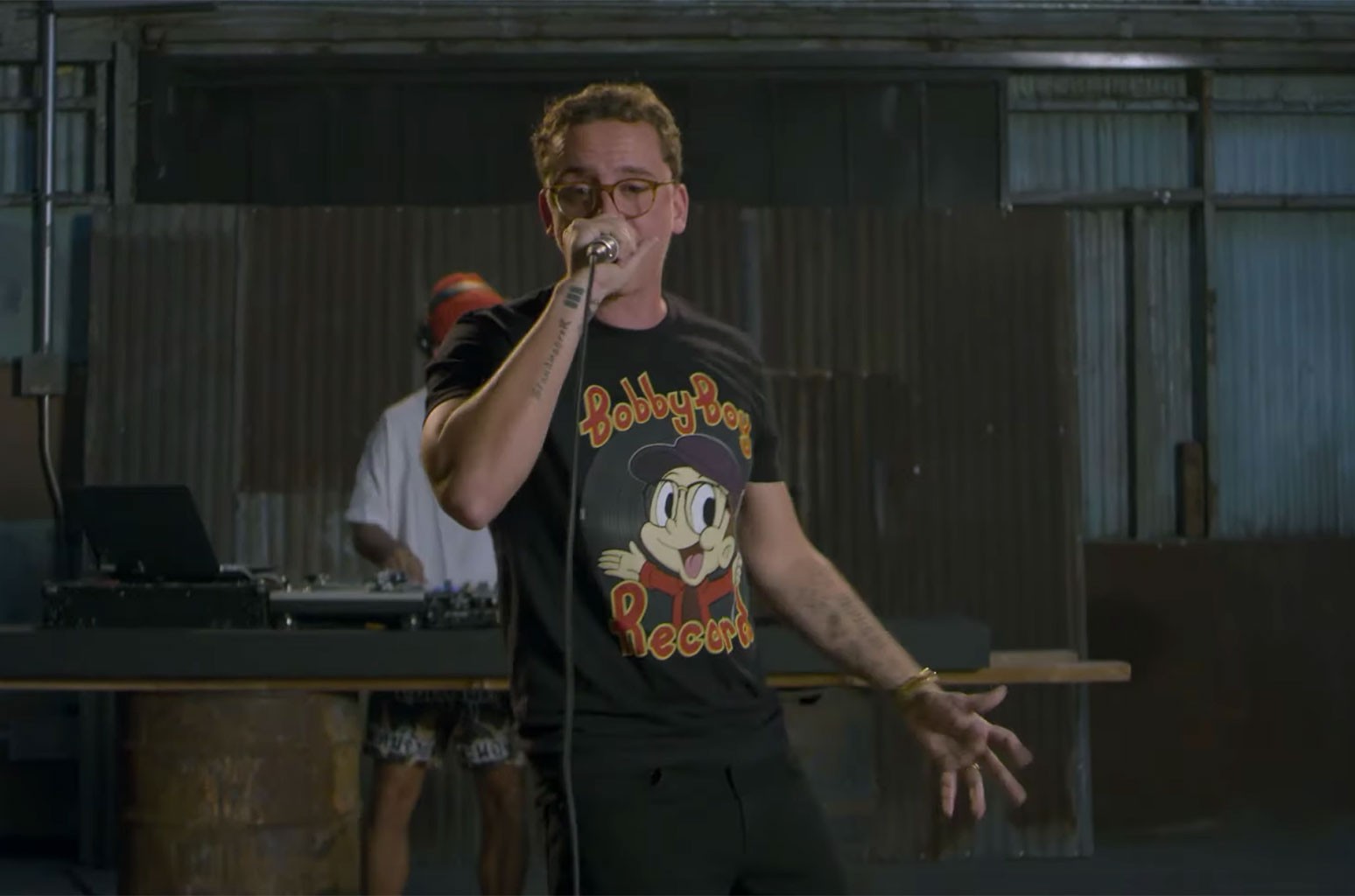 Logic performing his "No Pressure" freestyle while wearing a Bobby Boy Records t-shirt. 