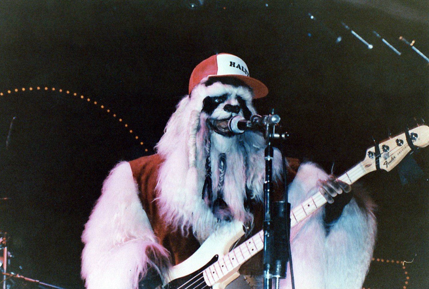 Bassist Roger Freeland aka "Baharnoth" rocking out on stage wearing a hat some young fans made.