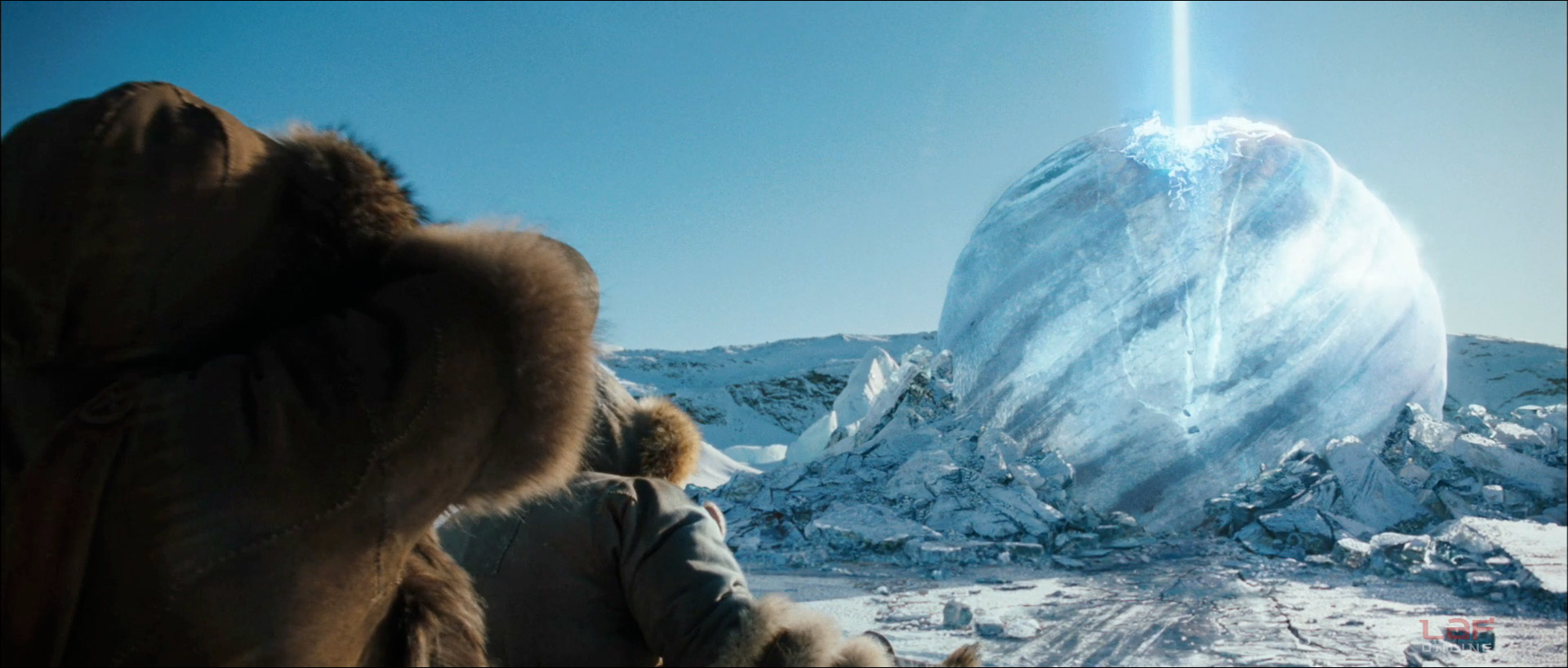 Sokka and Katara watch as a bright light emerges from an iceberg.