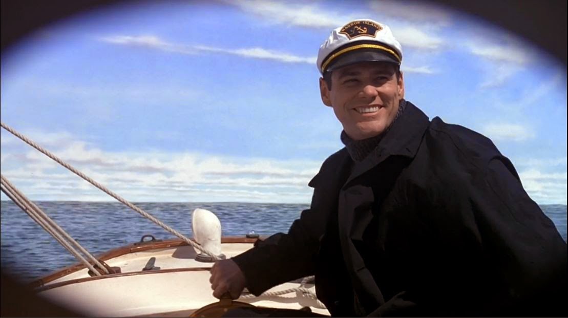 Truman is in his sailboat heading towards the exit of the set.