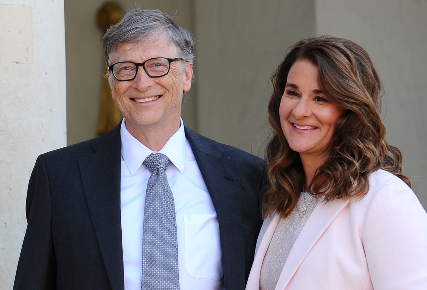 Bill and Melinda Gates stand together in formal attire.