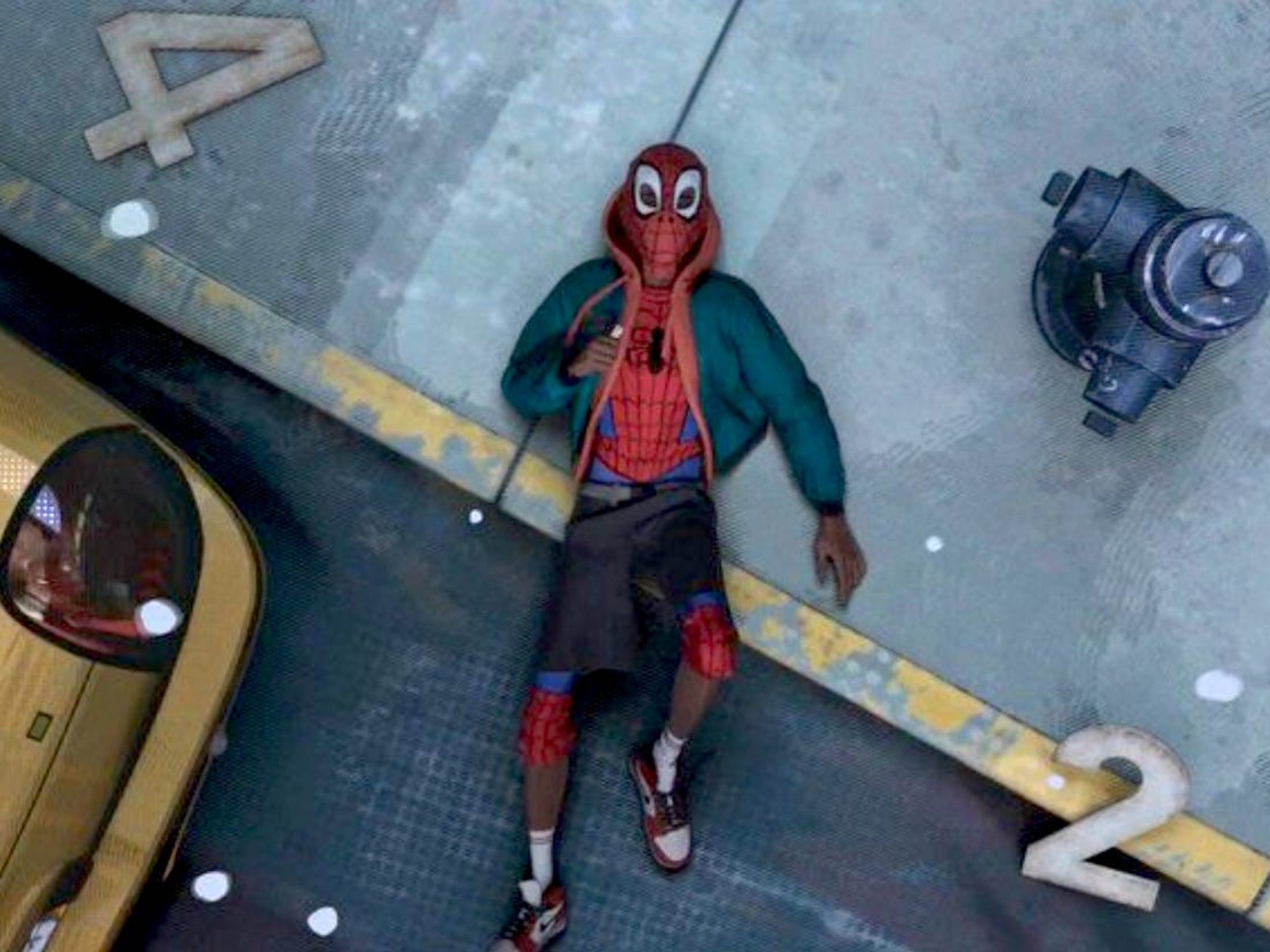 This image is from Spider-Man: Into the Spider-Verse (2018), where Miles made a rough landing after attempting to use his new Spider-Man powers. 