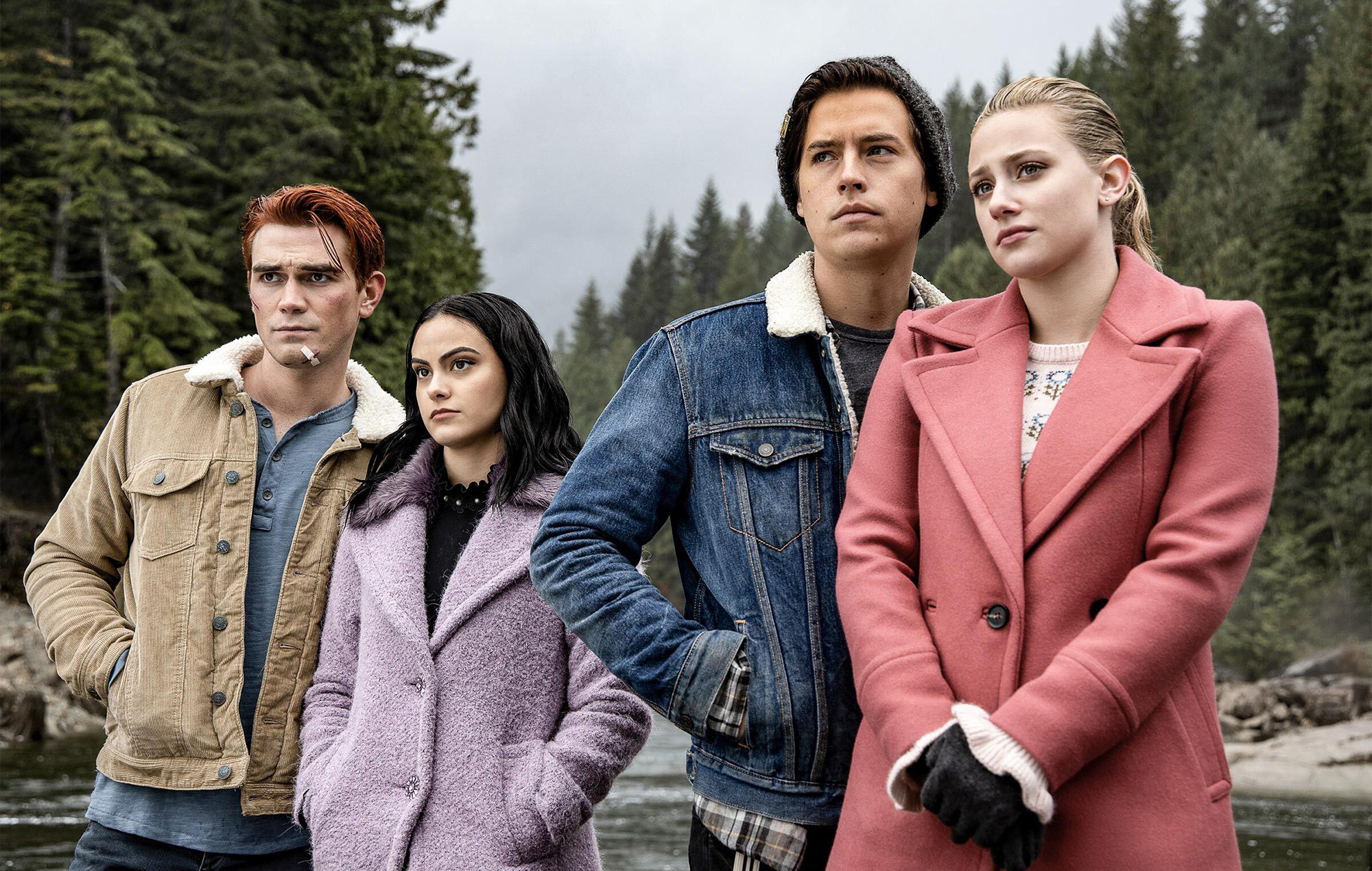 Teens Archie, Betty, Veronica, and Jughead from Riverdale staring into the stance. 