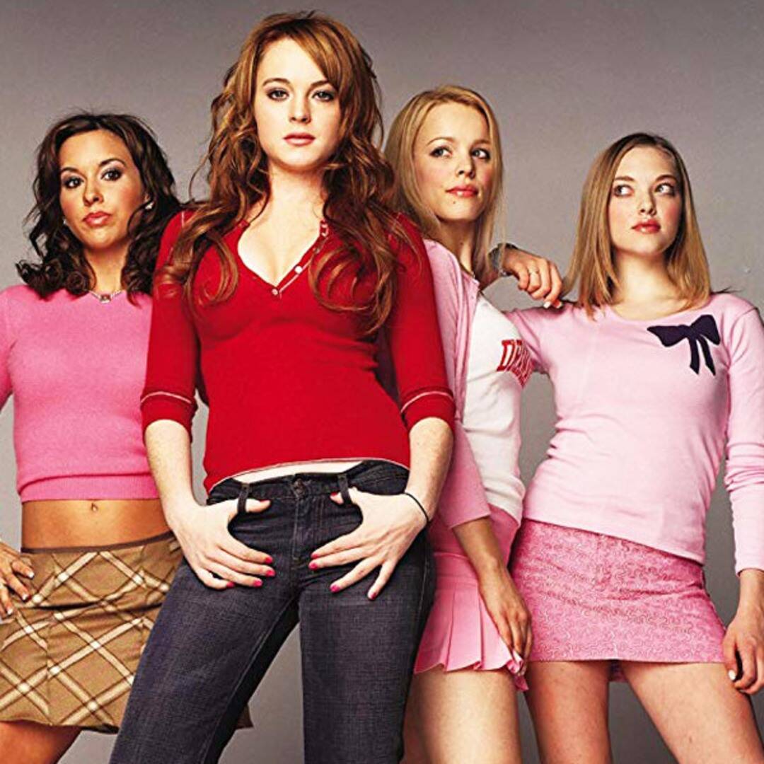 Mean Girls characters Gretchen Weiners, Regina George, and Karen Smith staring at Cady Heron. 