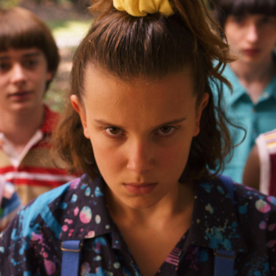 Eleven from Stranger Things staring angrily.