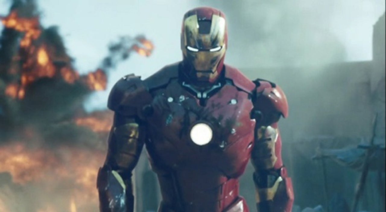 Scratched and sooty but otherwise unharmed, Iron Man walks away from a massive explosion.
