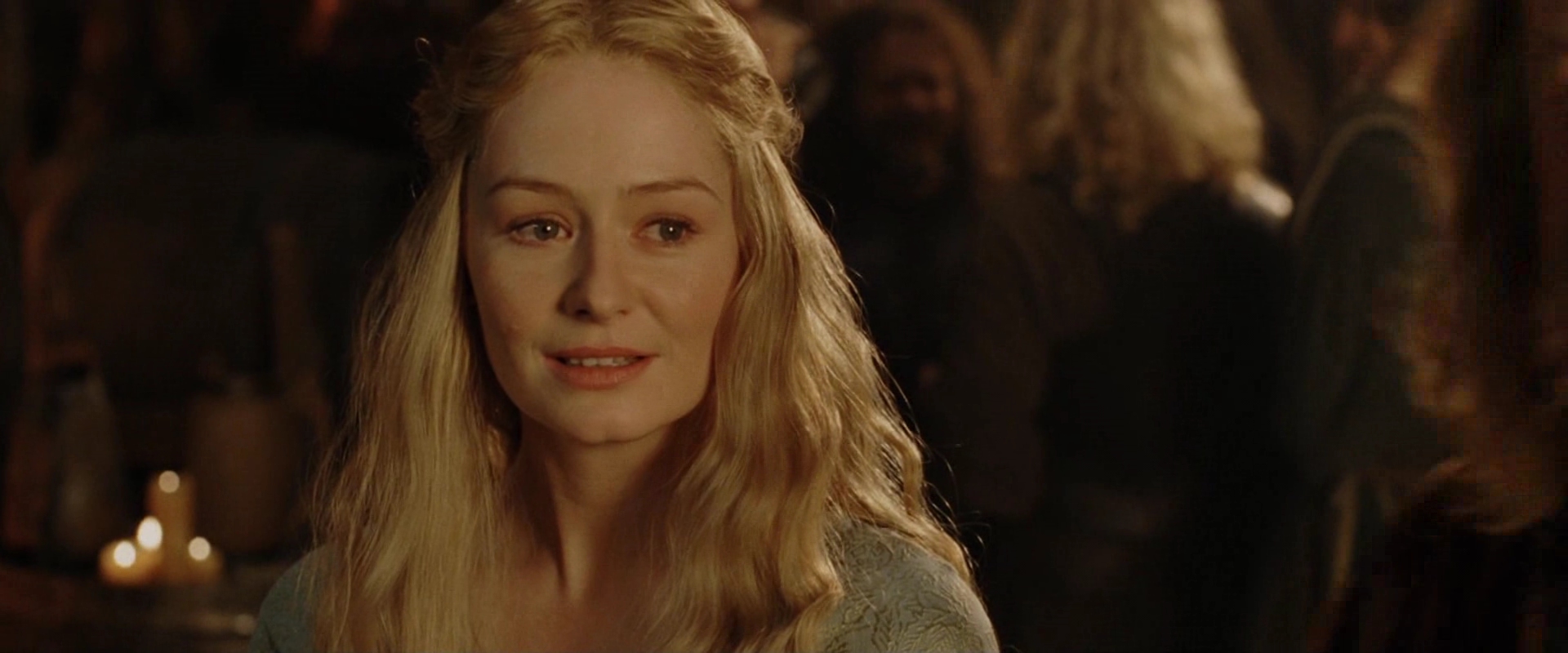 Eowyn looks at Aragorn in the halls of the Rohirrim.