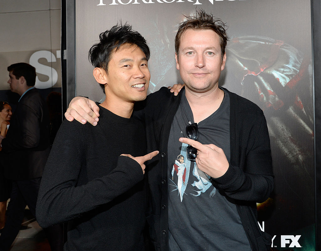 Whannell and Wan pose at a movie premiere.