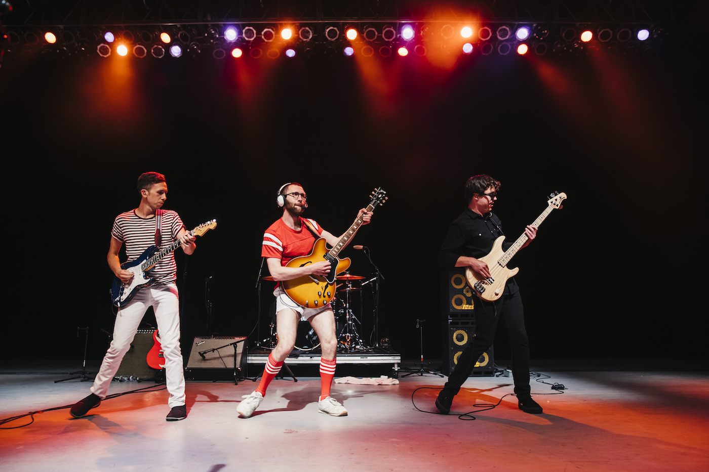 Vulfpeck members Joe Dart and Jack Stratton (in his signature short shorts) and frequent collaborator Corey Wong onstage, swaying to the beat with their guitars.