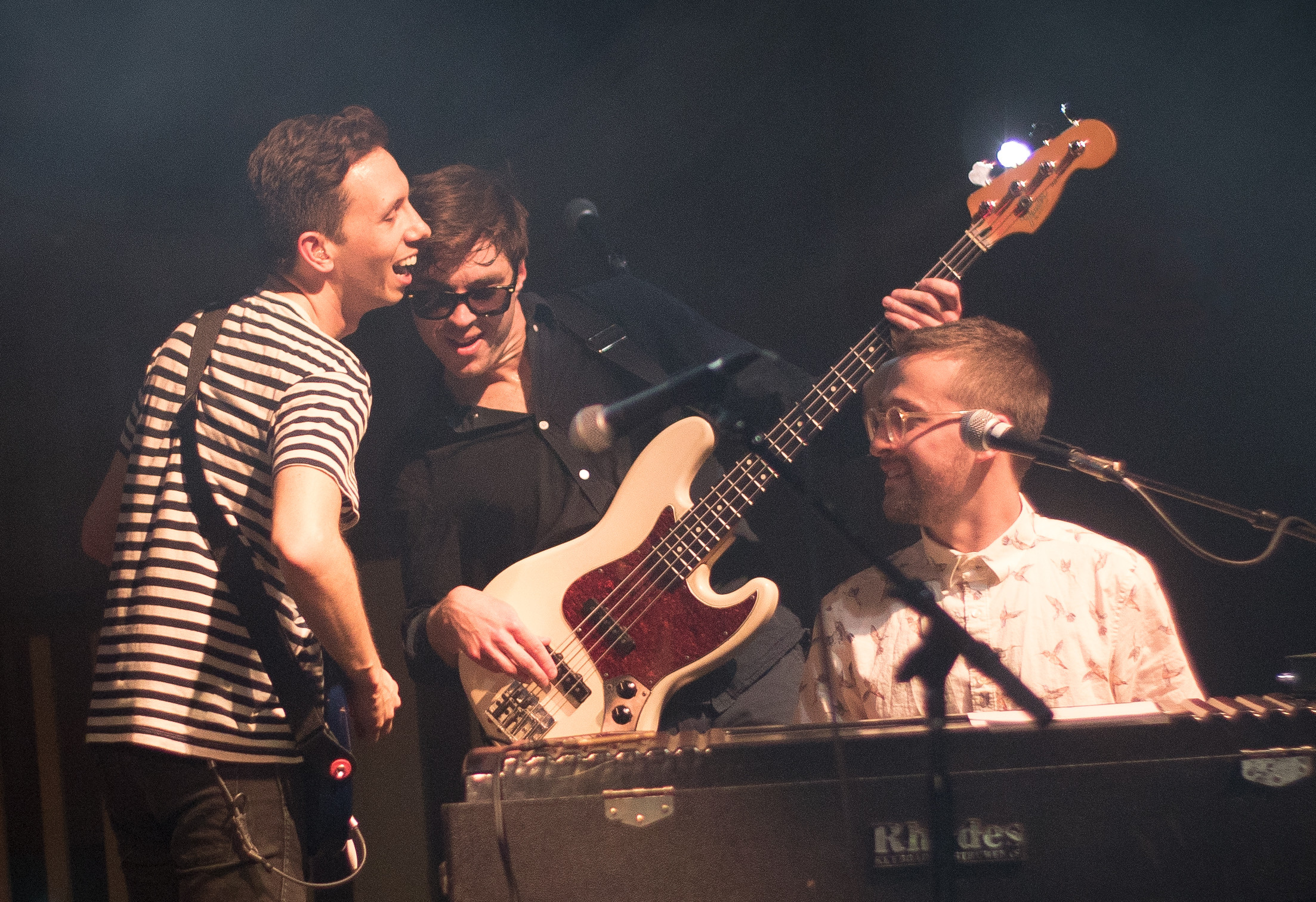 Vulfpeck members Joe Dart and Woody Goss playing onstage with frequent collaborator Cory Wong. 