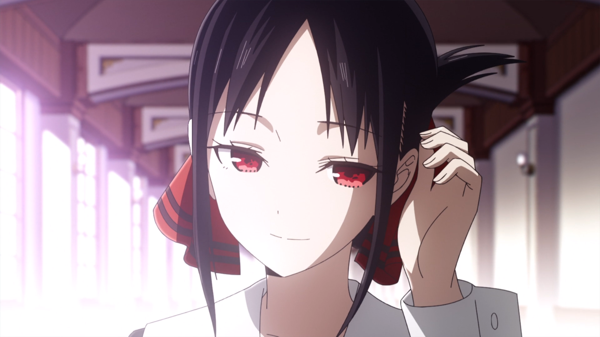 Kaguya Shinomiya walks down the hallway of Schuchiin Academy in Kaguya-sama: Love Is War.