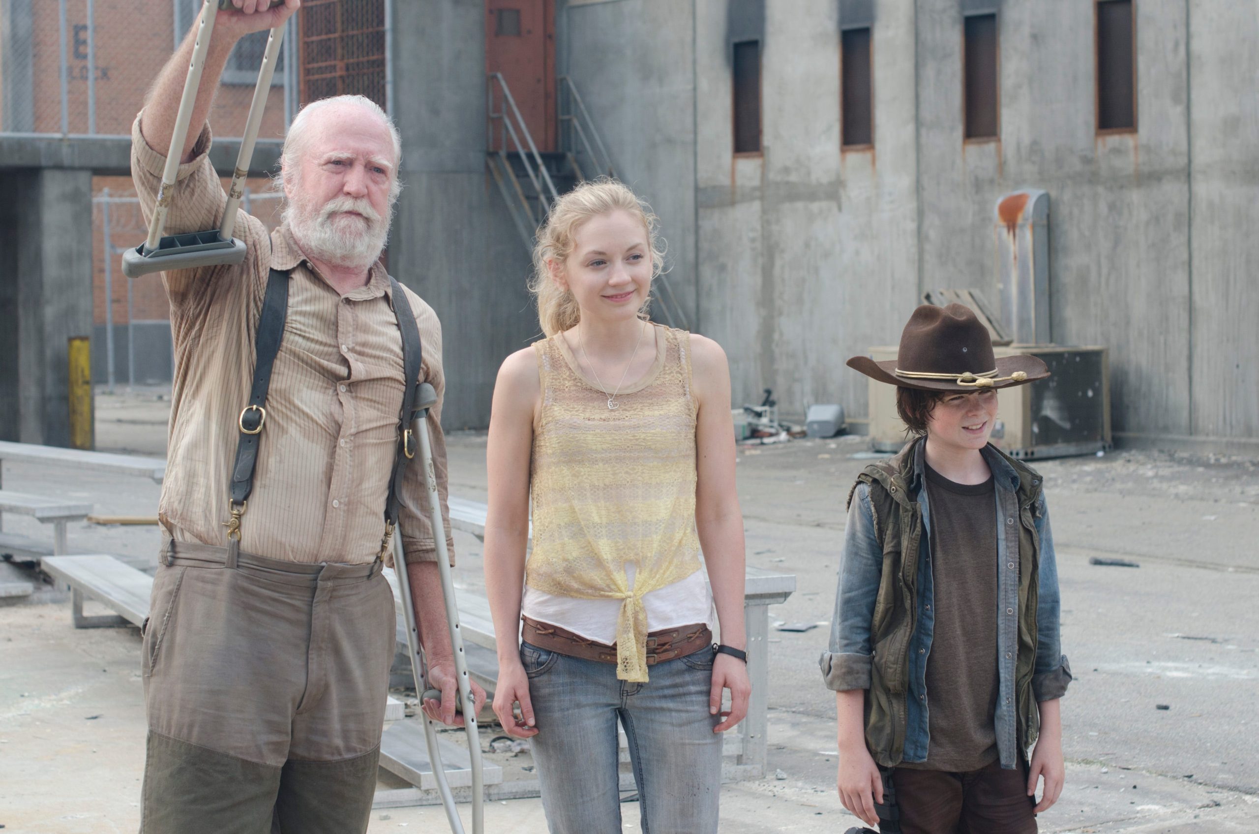 From right to left, Hershel, Beth, and Carl at the prison camp in season 4.