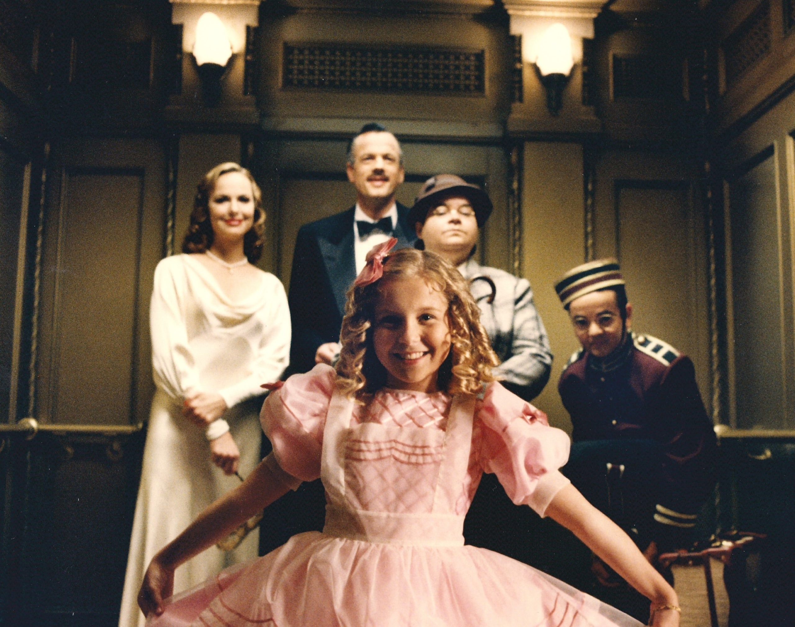 The ghostly cast poses in the elevator in a promotional photo for Disney's Tower of Terror. 