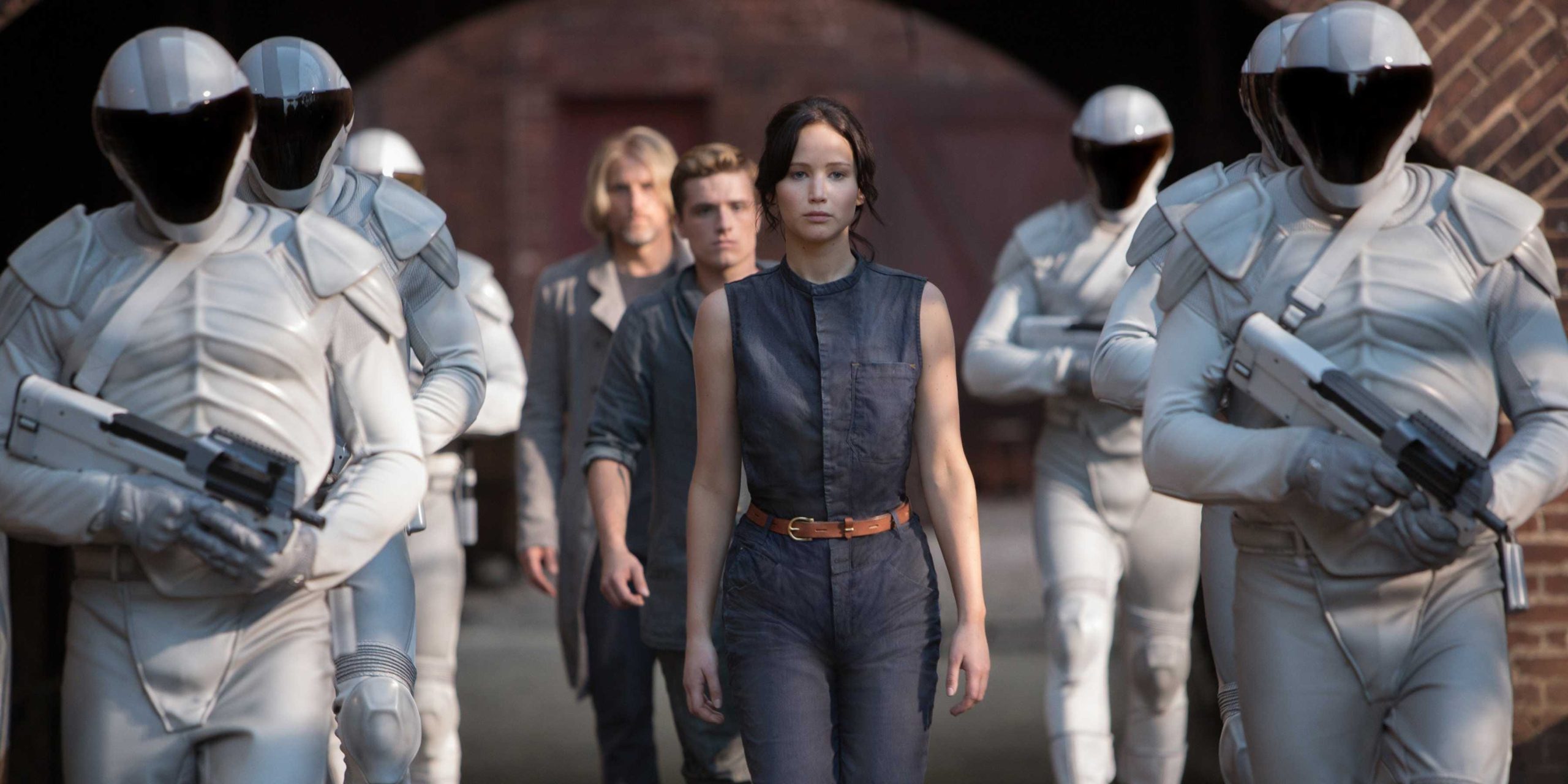 Katniss, Peeta, and Hamitch walking into the Quarter Quell ceremony.
