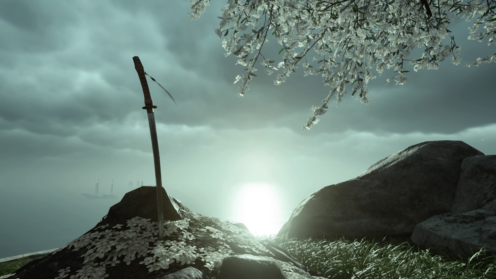 A shot of a grave in "Ghost of Tsushima." It is marked by rounded earth, a large stone, and small white flowers. It has a katana-style sword thrust into the middle. Beyond can be seen the ocean, and overhead are the branches of a white-flowered tree.