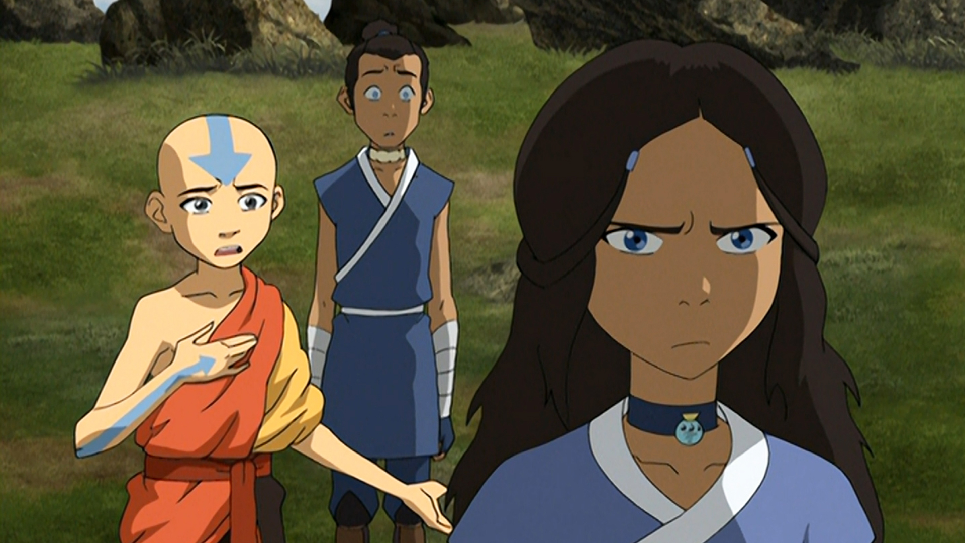 An angry Katara faces away from Aang as he tries to convince her not to seek revenge.