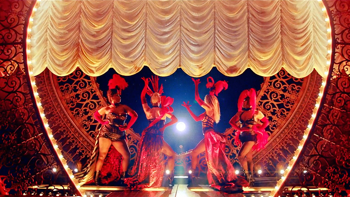 Four women welcome audiences to the Moulin Rouge.