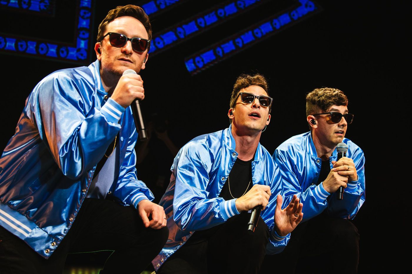 Akiva Schaffer, Andy Samberg, and Jorma Taccone perform their songs at a show.