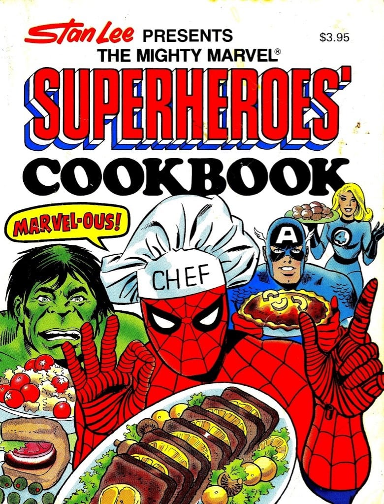 The cover of a superhero cookbook is showing Spider-man wearing a chef hat and serving a dinner to the Hulk, Captain America, and Sue Storm.