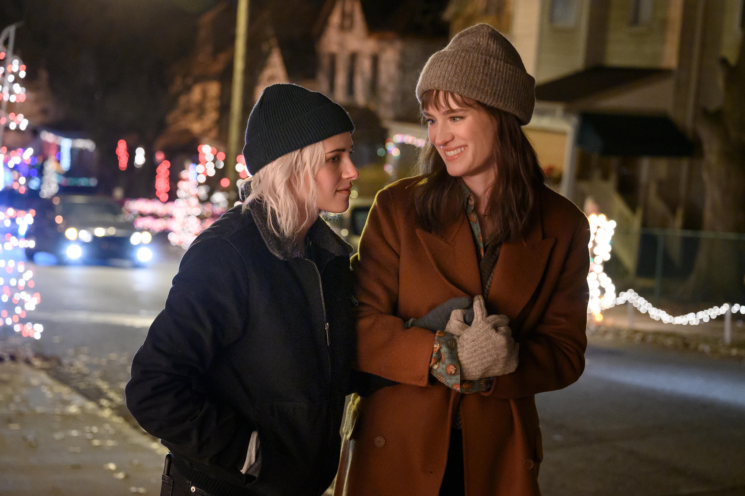 Abby and Harper holds hands while walking in Happiest Season.