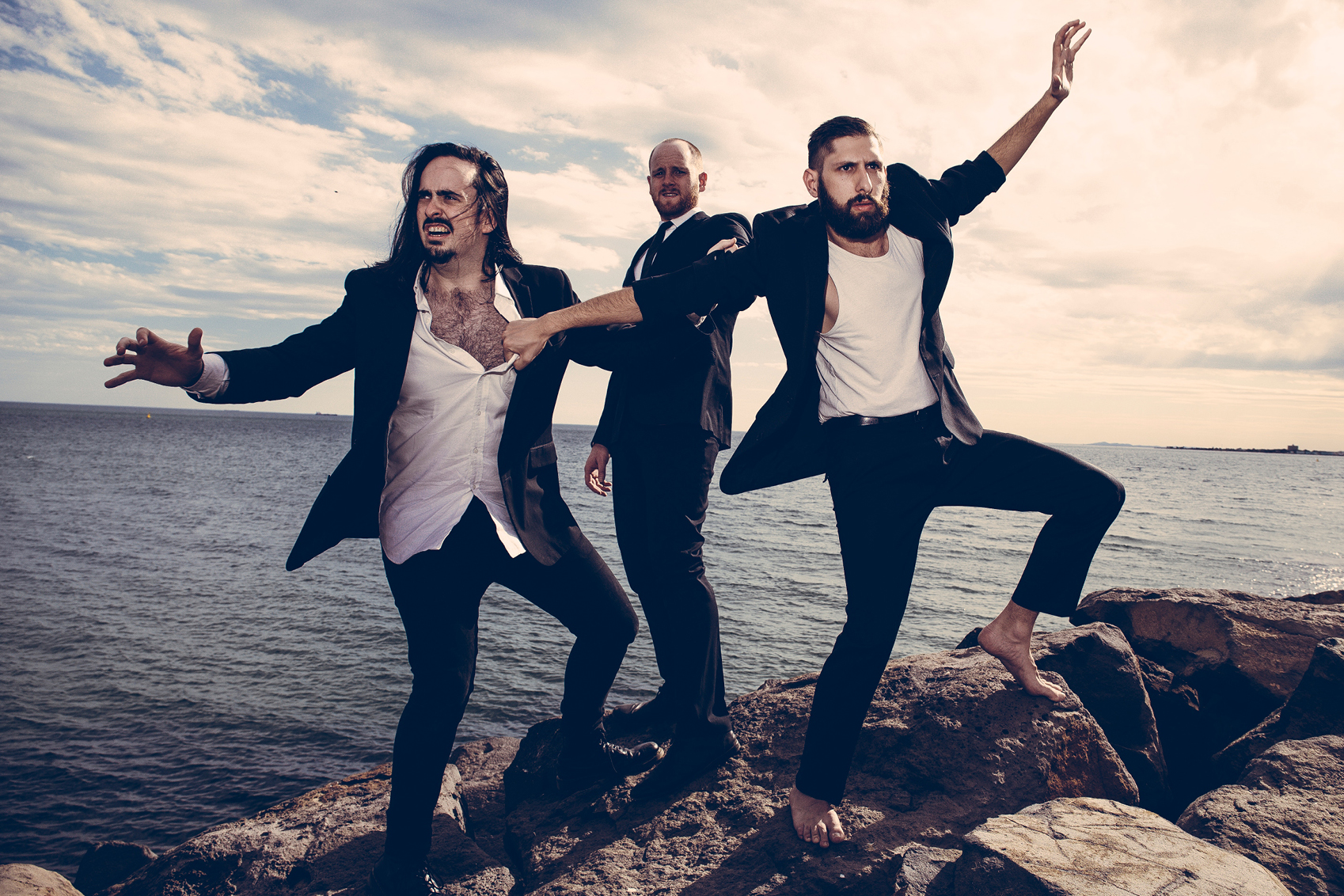 Three cast members of Aunty Donna smile at the camera