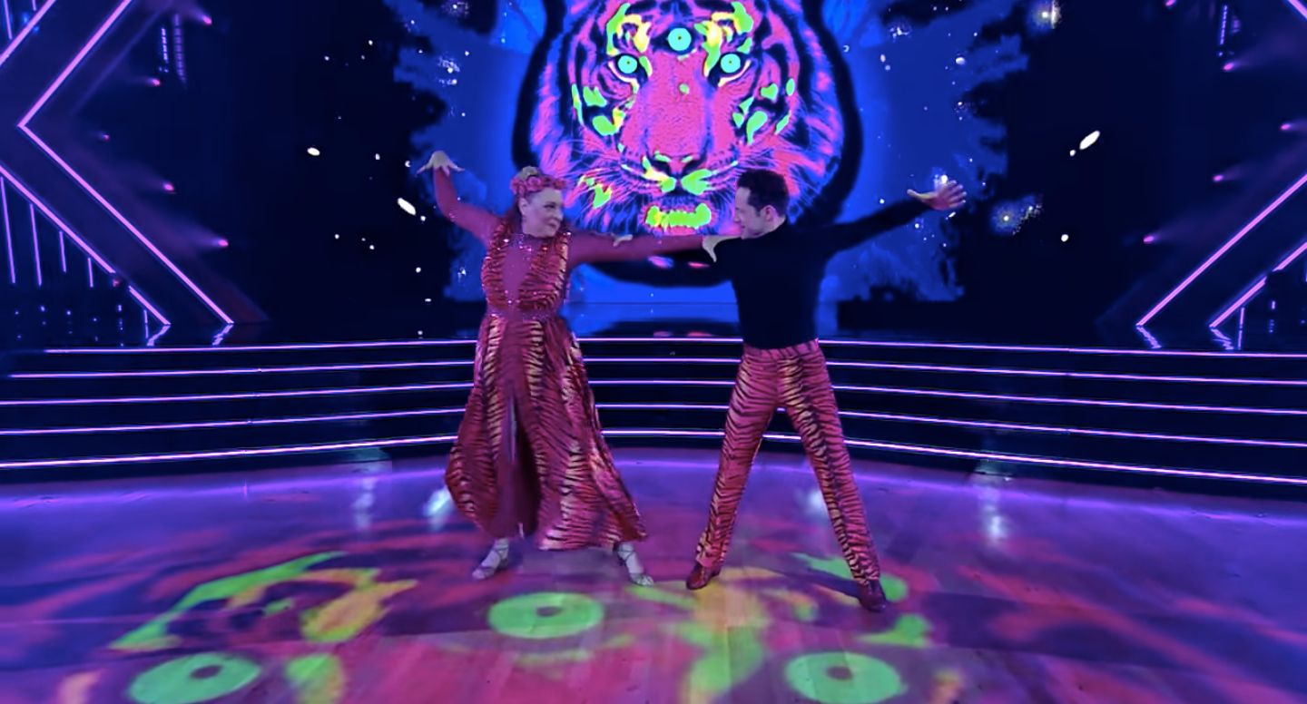 Carole Baskin and partner Pasha dance on Dancing With the Stars in pink costumes.