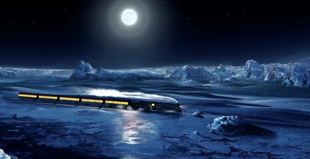 the polar express makes its way through the snowy tracks.