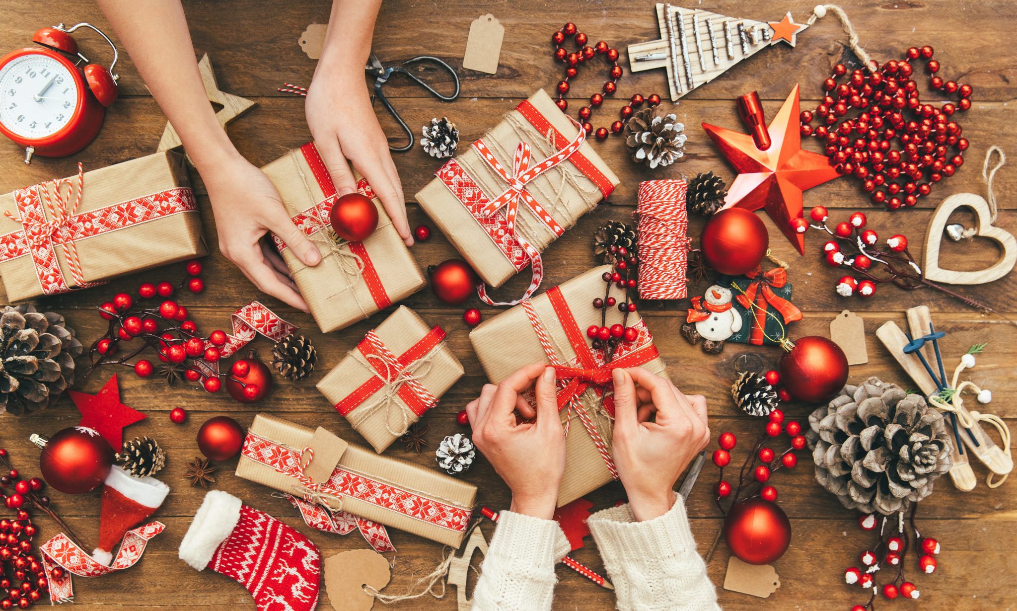 People wrapping Christmas gifts is a long standings tradition.