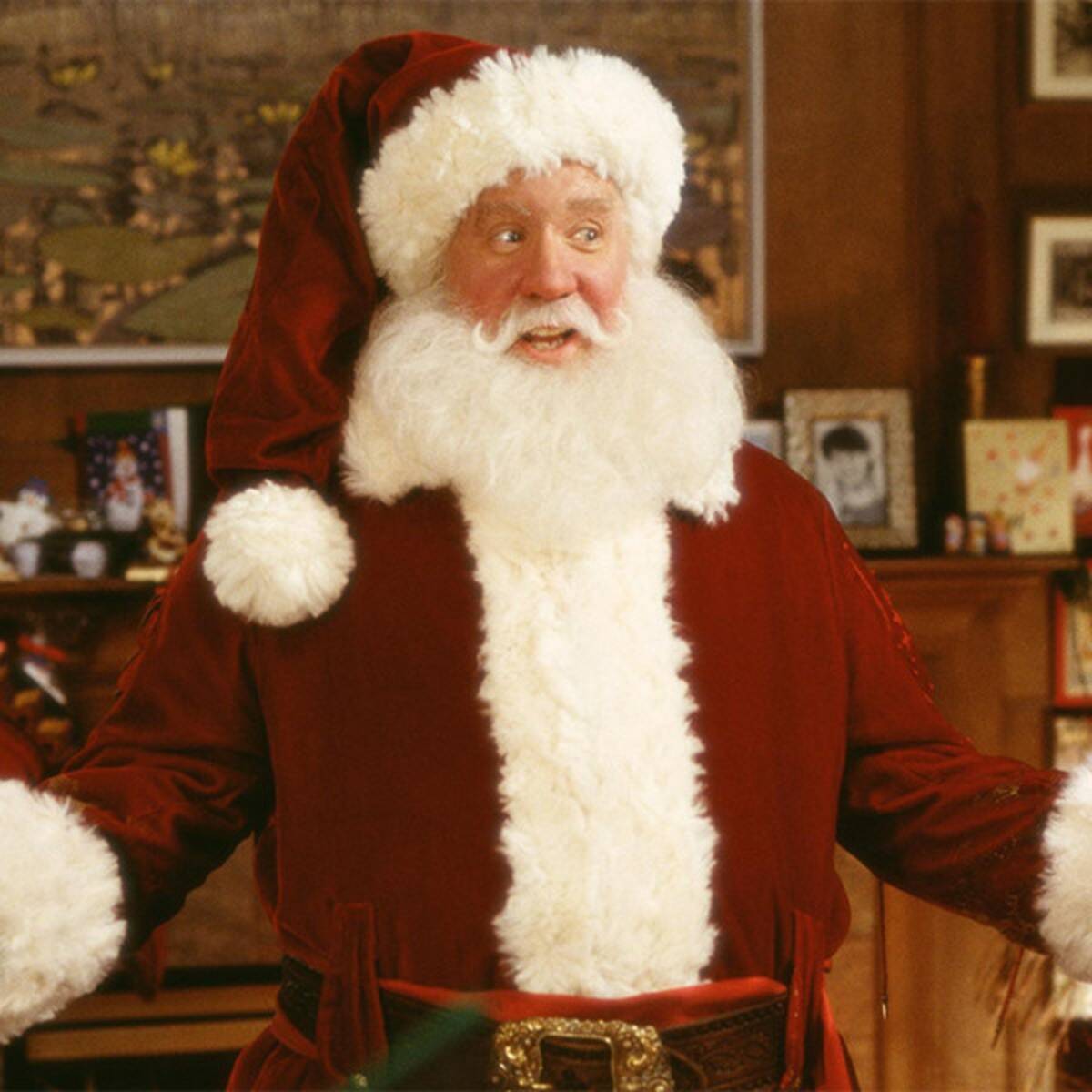 Allen's Santa Claus shows off his iconic Santa outfit: red coat and hat with white trim.