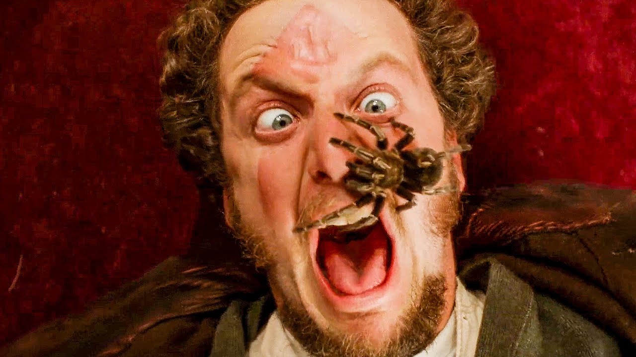 Marv, the burglar, screams in terror as a tarantula crawls on his face.