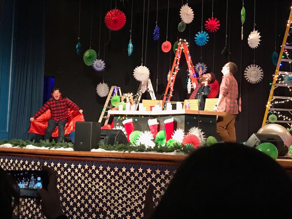 The McElroy brothers take part in My Brother, My Brother, And Me live show Candlenights traditions.