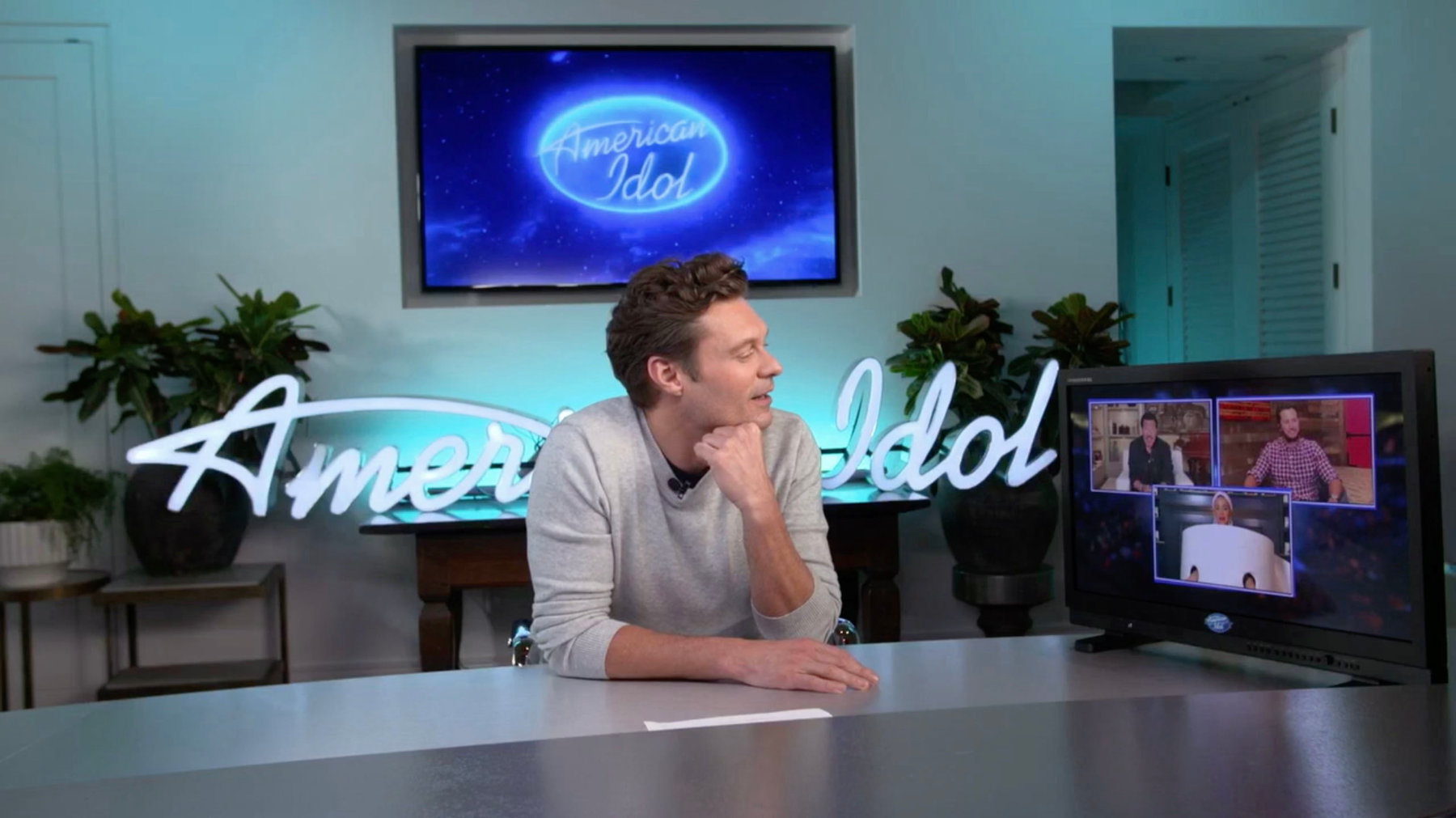 Reality TV hose Ryan Seacrest talking to American Idol contestants over Zoom.