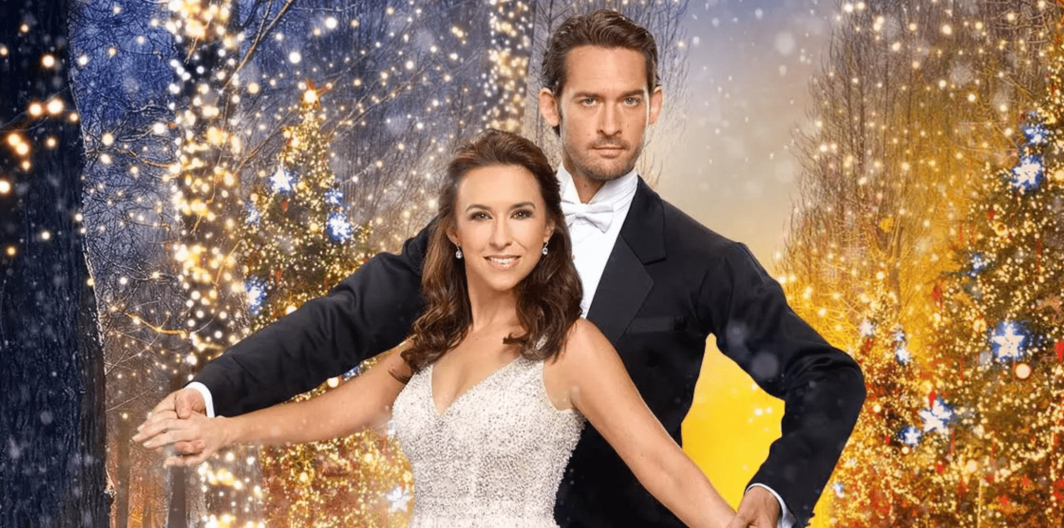 The main couple holds a ballroom dance pose facing the camera in front of a stylized Christmas light backdrop.