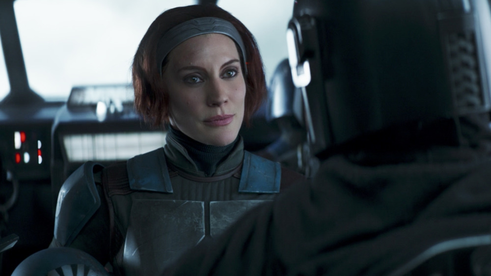 Bo-Katan Cryze, ruler of Mandalor with her helmet removed speaking to Mando. Season Two, Episode 11 of The Mandalorian.