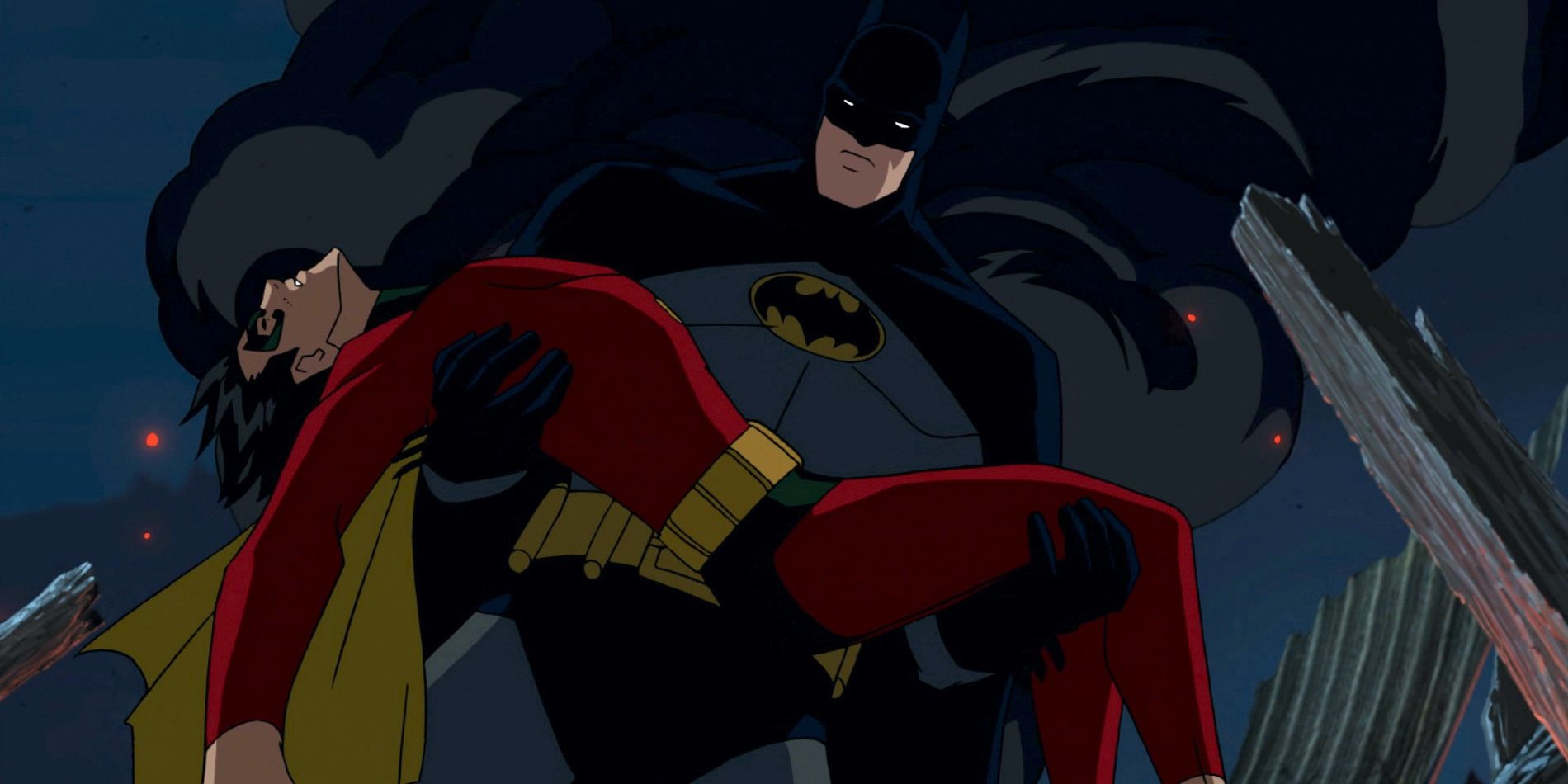 Batman carries Jason Todd's dead body in 'Under The Red Hood'. Directed by Brandon Vietti, 2010.