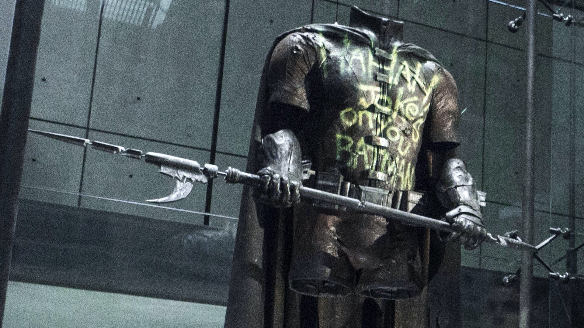 A vandalized Robin costume sits in the Batcave in 'Batman v. Superman' directed by Zack Snyder, 2016.