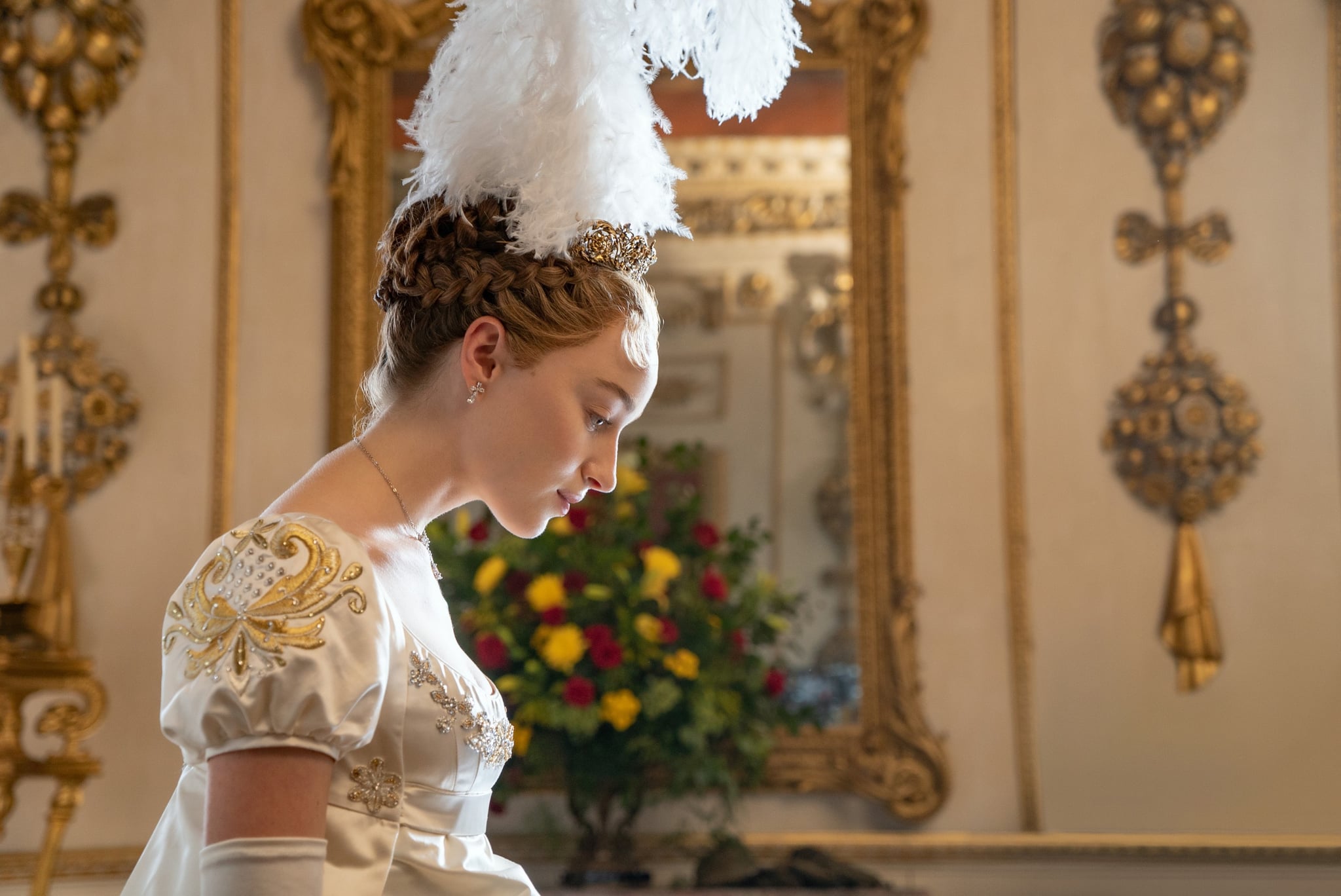 Daphne Bridgerton bowing down to the queen as she is introduced to high society in London.