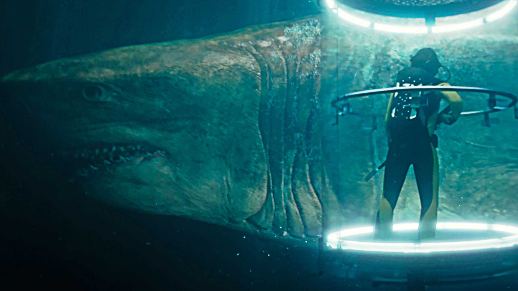 The megalodon swimming around Suyin in her shark cage in The Meg.