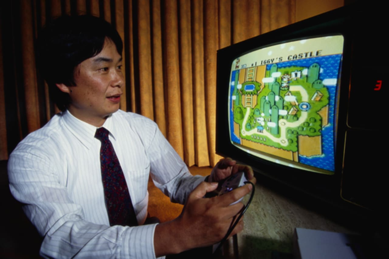 Shigeru Miyamoto playing Super Mario World on the Super Nintendo Entertainment System.