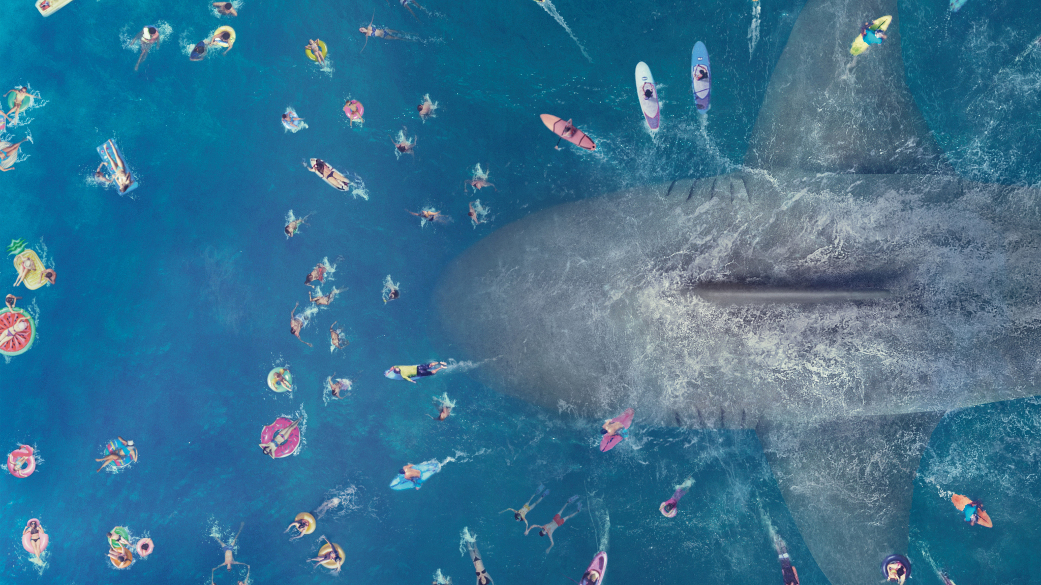 The megalodon making his way through swimmers at a beach, showing the massive size difference between a person and a megalodon.