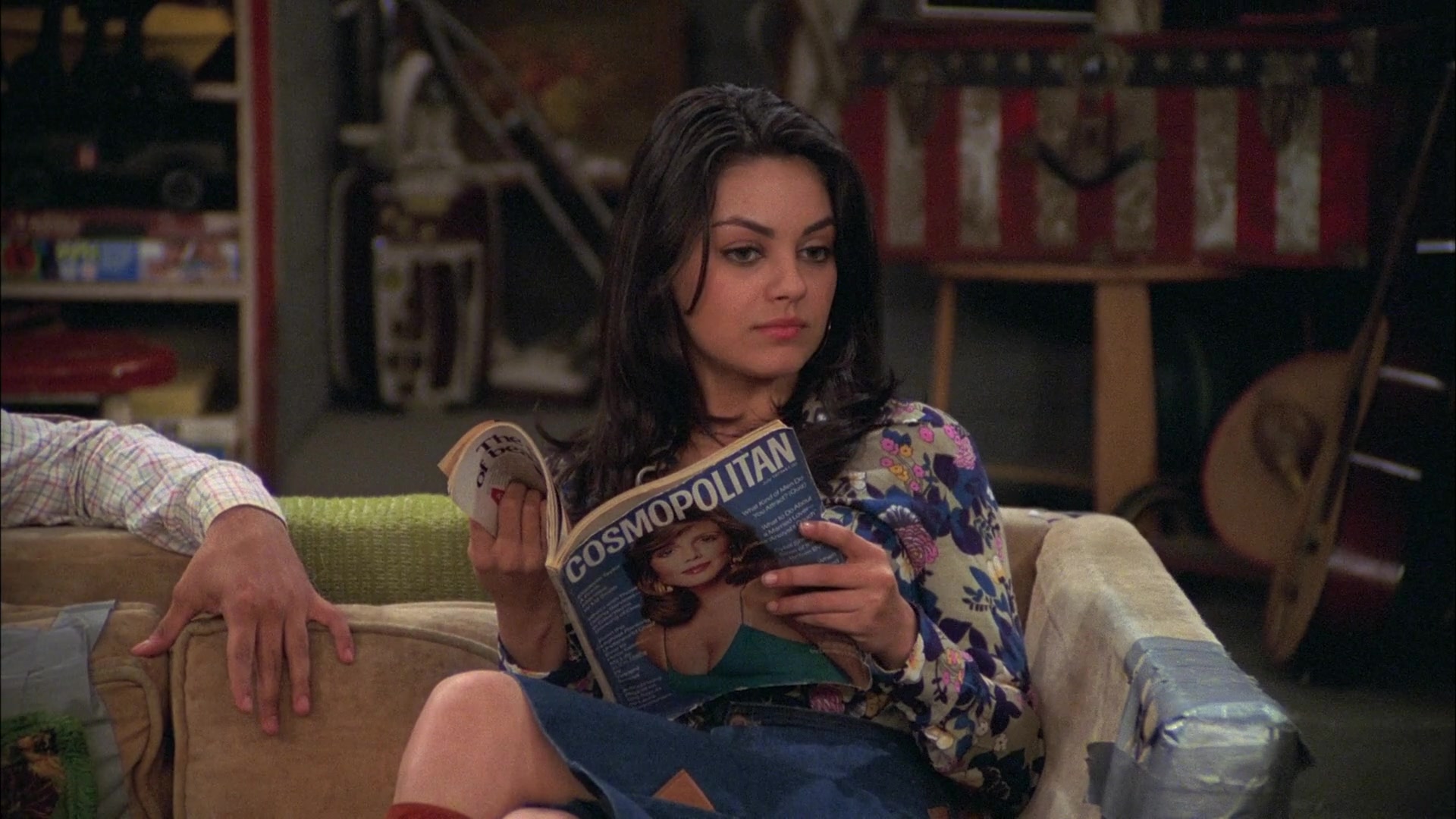 Jackie Burkhart from That 70s Show reading Cosmo and being snarky as usual.  