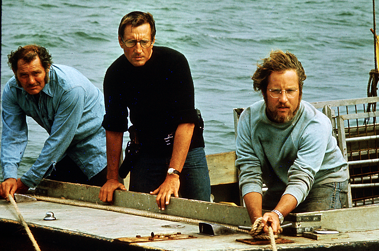 From left to right, Quint, Chief Brody, and Hooper on the Orca trying to kill the shark.