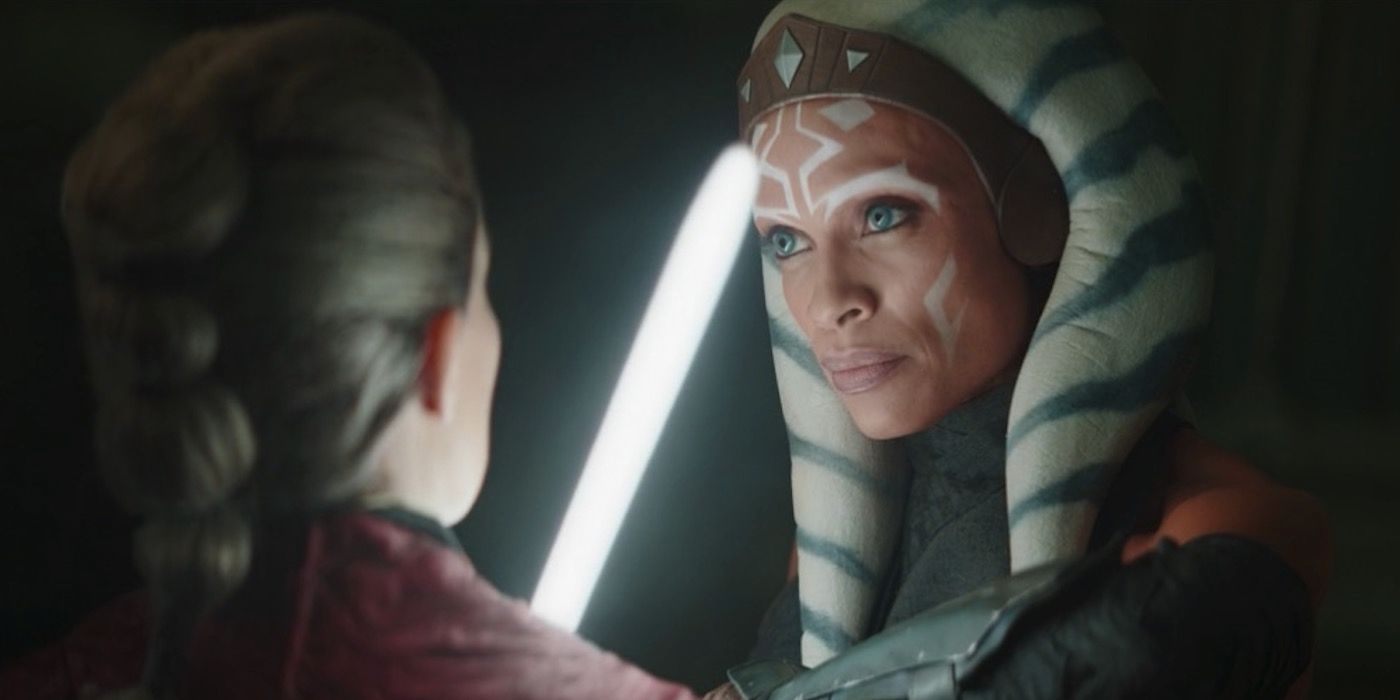 Ahsoka from The Mandalorian threatens someone with her lightsaber.