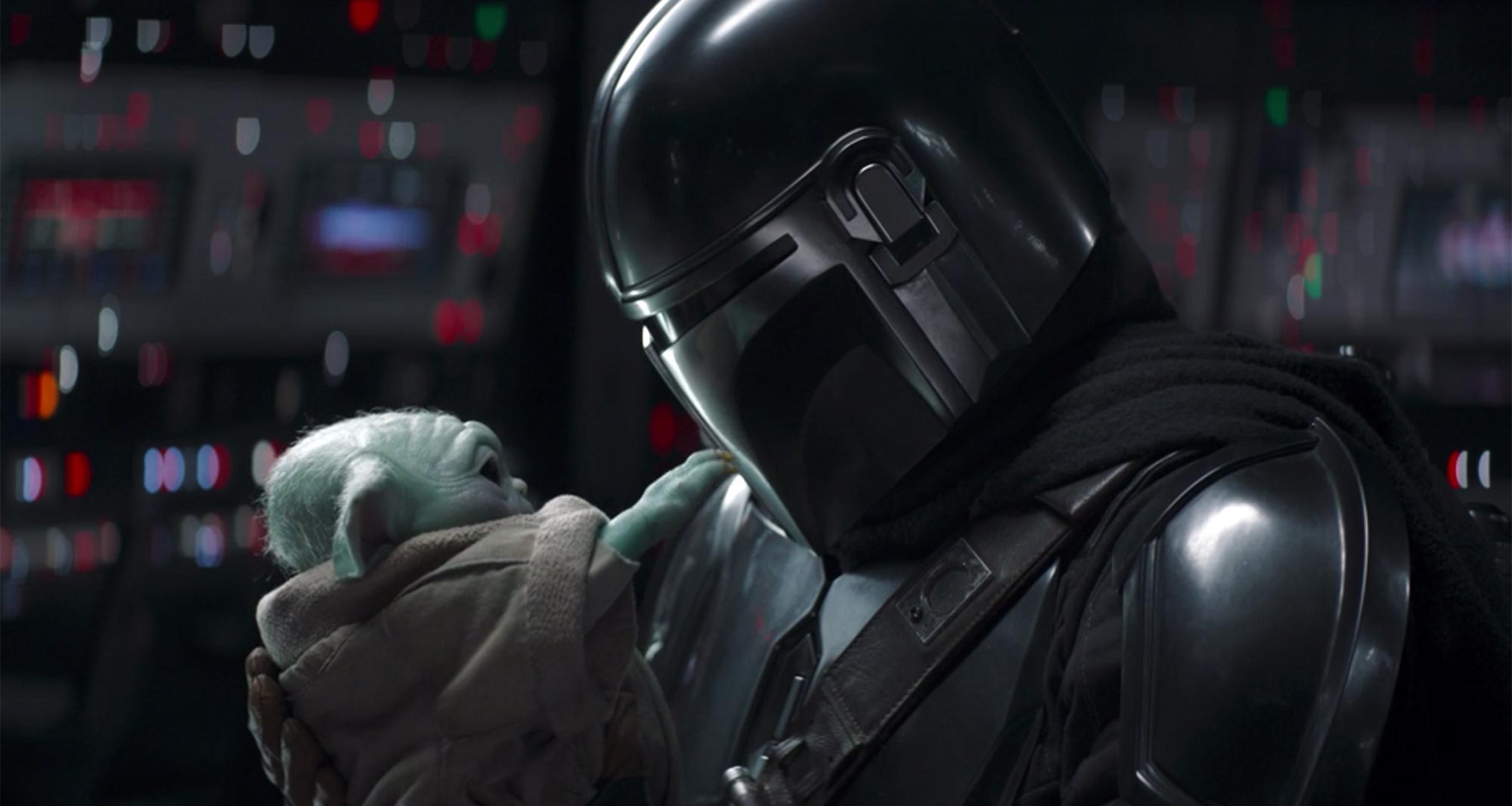 The Mandalorian Season two finale, Mando embraces Grogu before removing his helmet. 