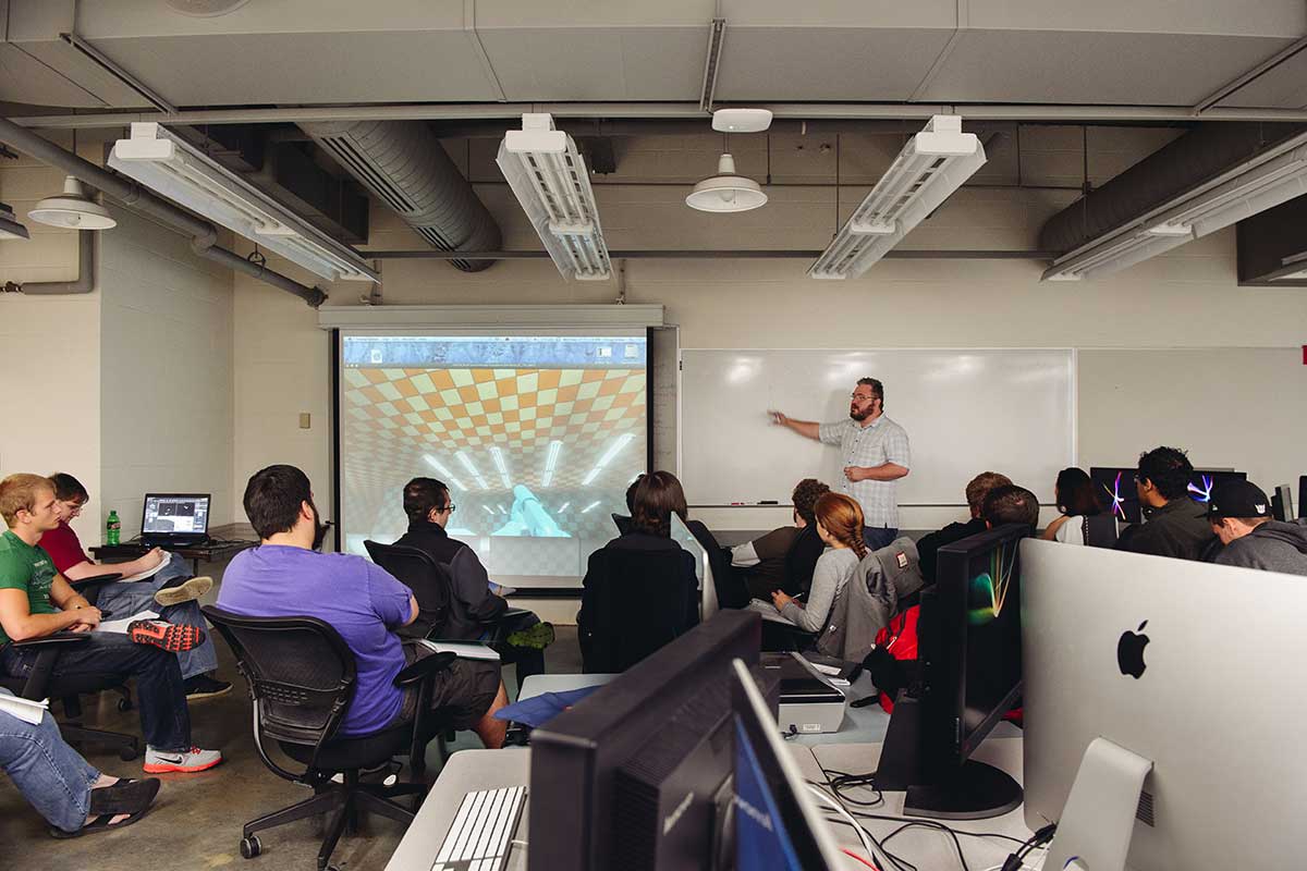 A classroom with students learning game design. 