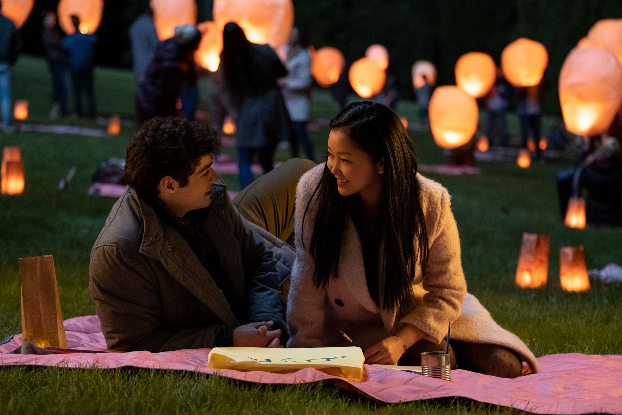 Lara Jean and Peter at a floating light festival on their first date.