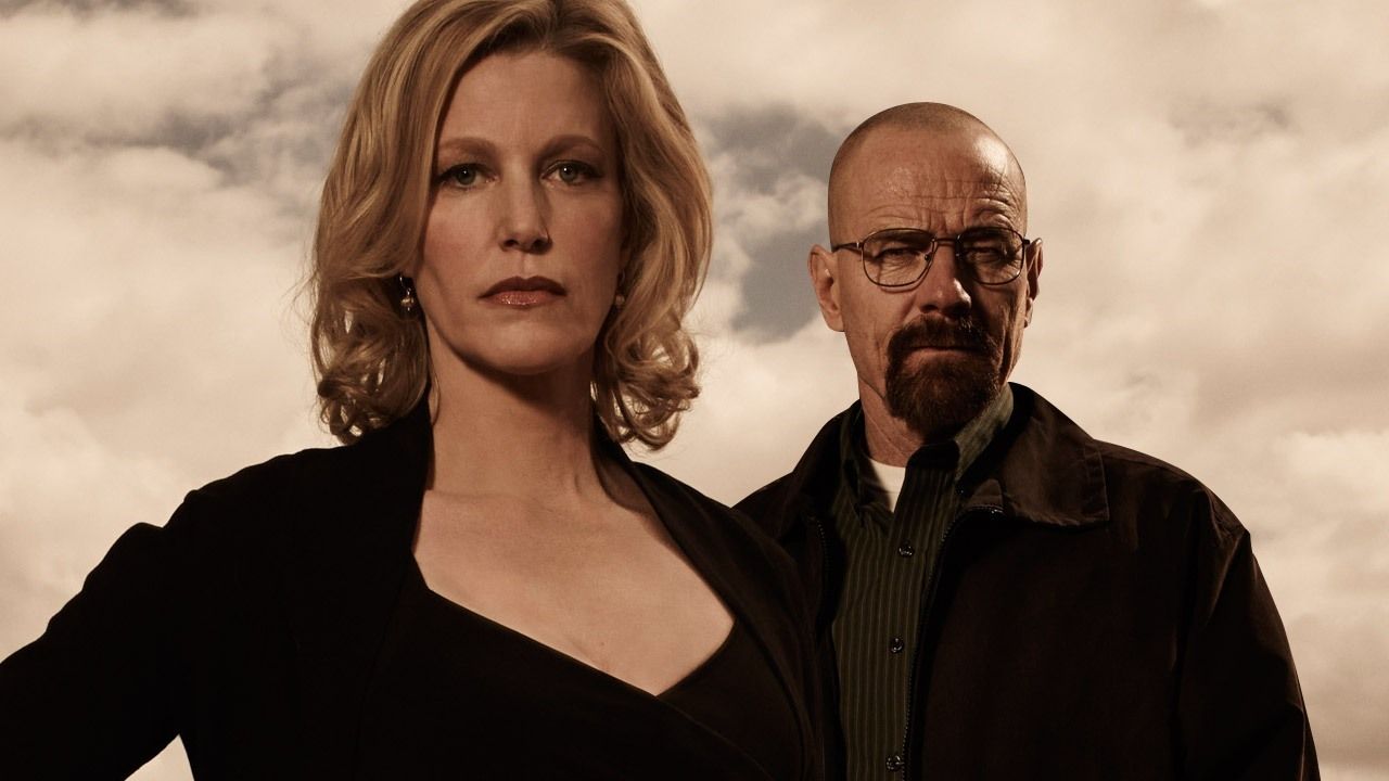 Skyler White and Walter White facing the camera with strong, emotionless expressions. 