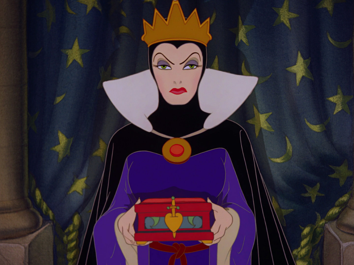 The Evil Queen in Snow White and the Seven Dwarfs is holding a box with a symbol of a pierced heart on it, meant to contain Snow White's actual heart.